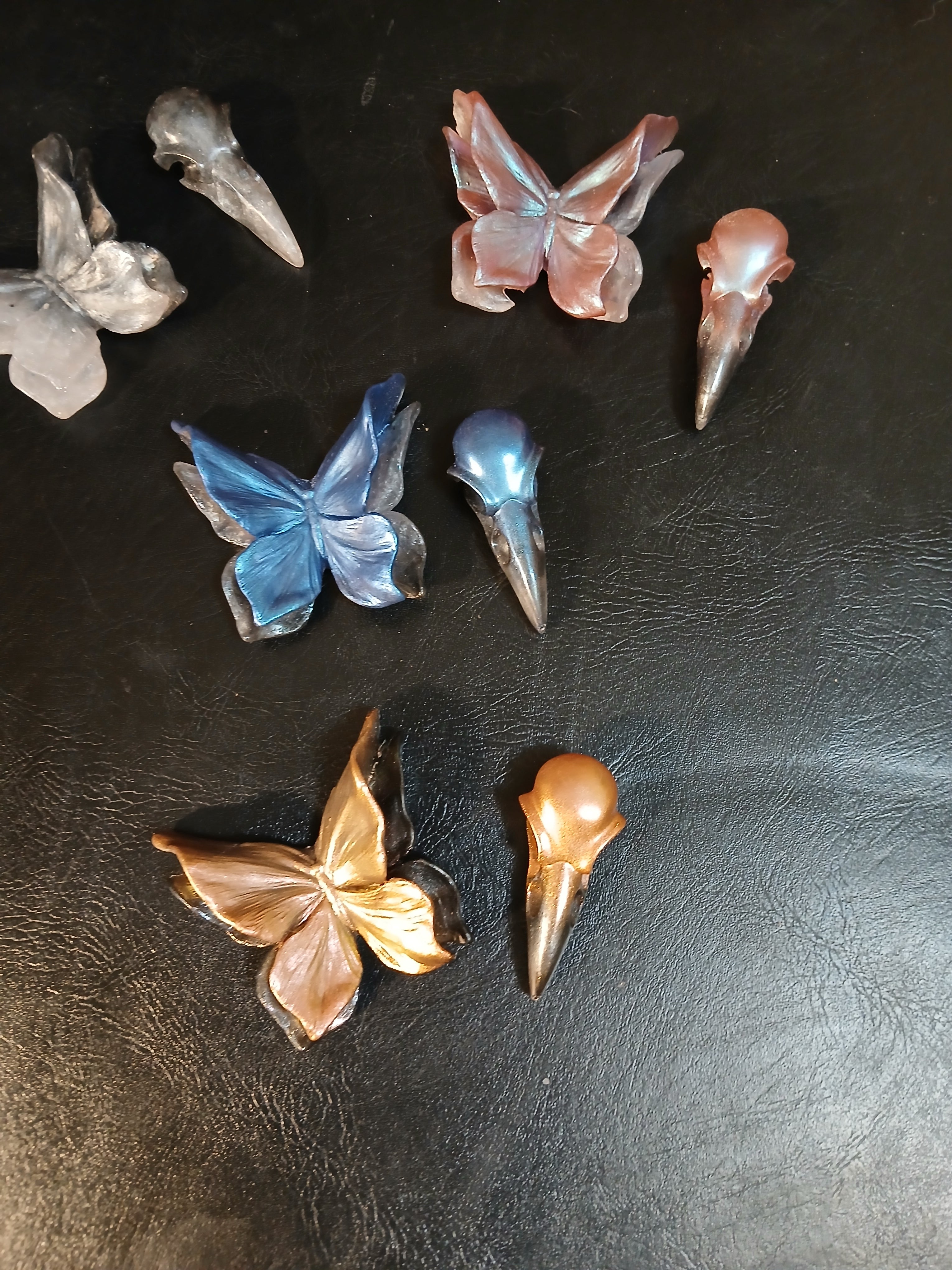 Butterfly and raven skull magnets